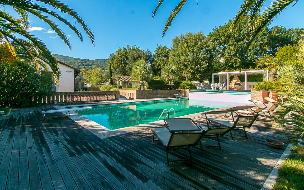 Villa delle Camelie is a luxury villa with swimming pool, tennis courts, and gym for sale