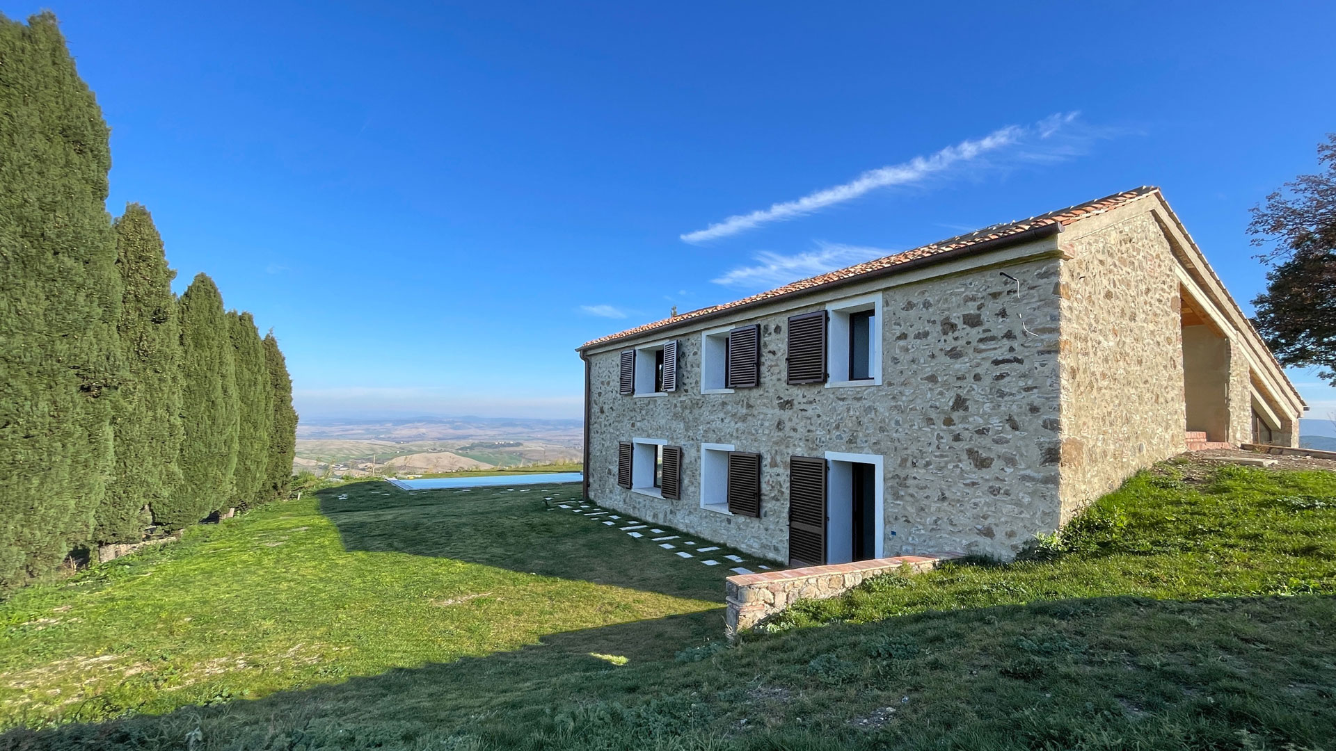 Stone farmhouse with breathtaking views of the Val d'Orcia and infinity pool