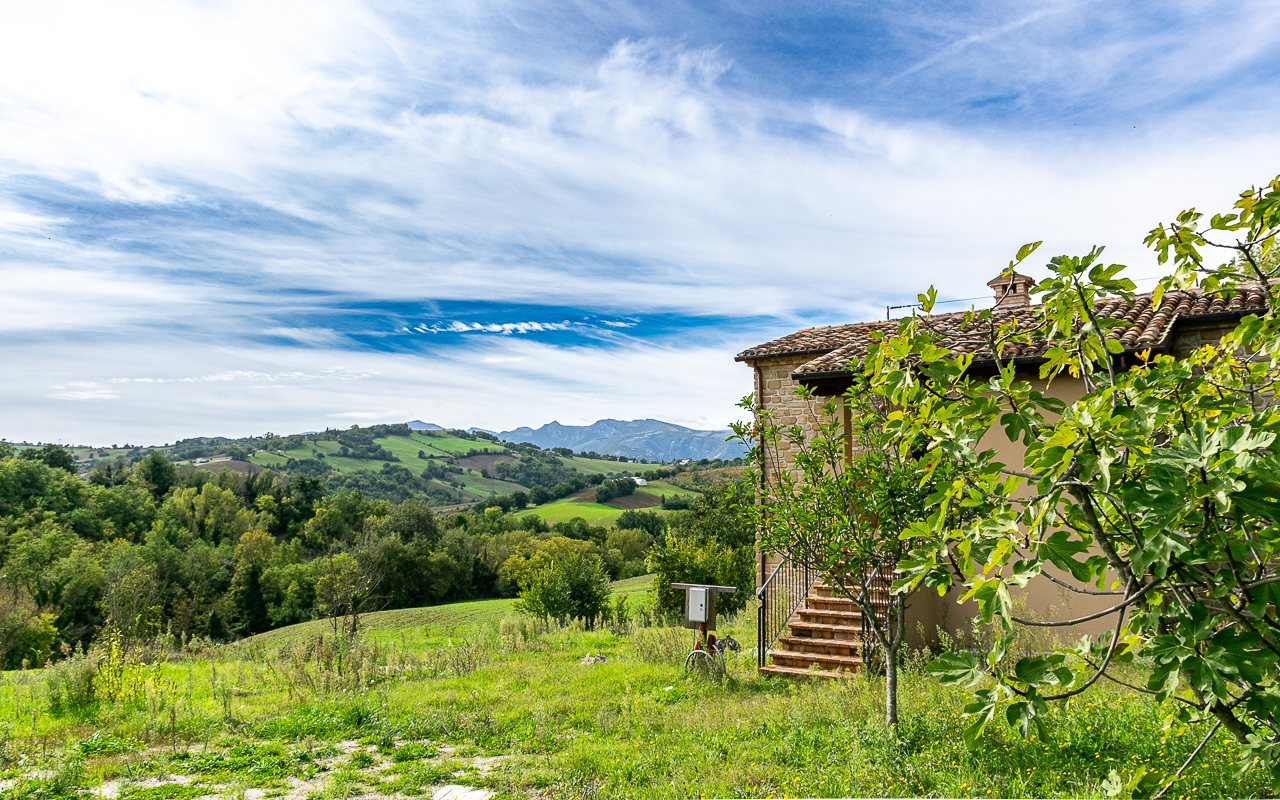 Nestled in the serene Italian countryside of Le Marche, this meticulously reconstructed farmhouse offers a harmonious blend of traditional charm and modern resilience
