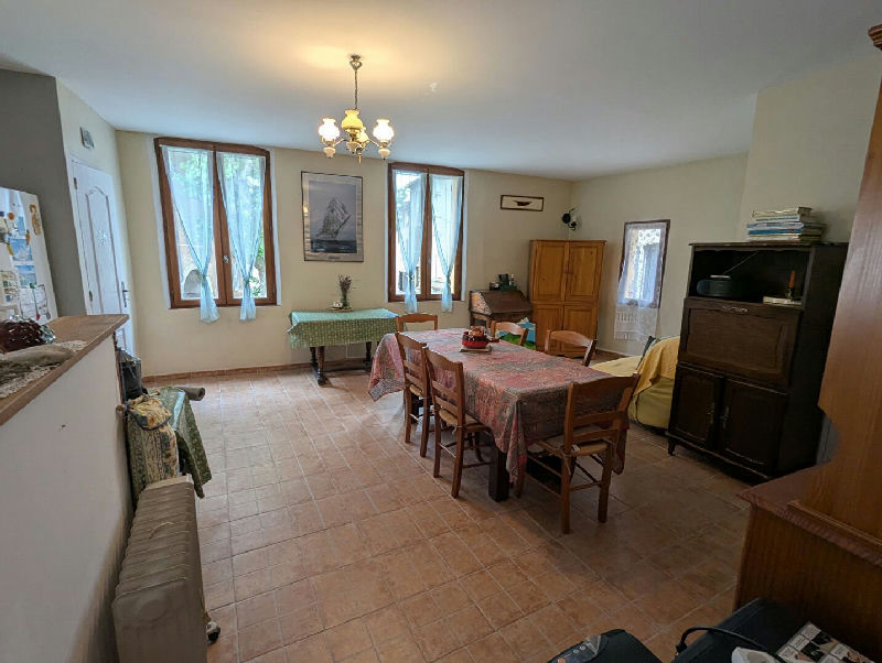 Real estate complex including an apartment and a studio
